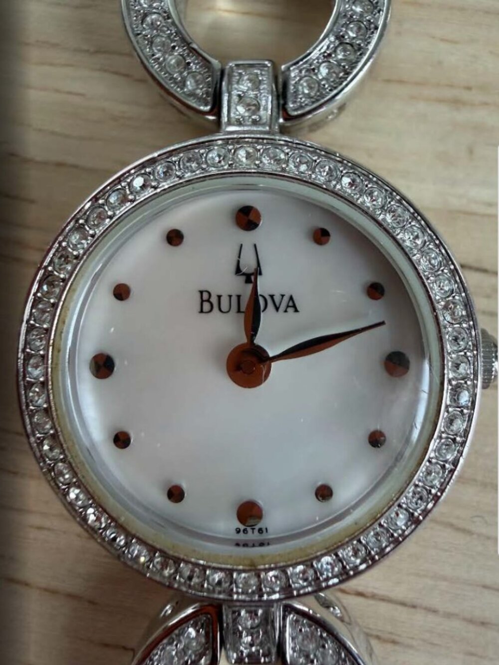 Bulova's ladies' watch with crystal circle link bracelet and a mother-of-pearl
